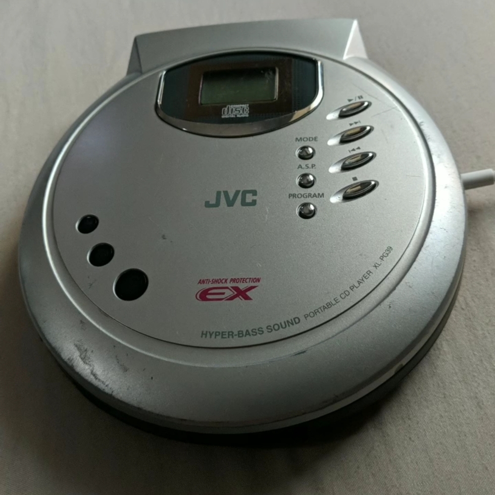 Silver Portable CD Player with Sleek Design and Compact Size